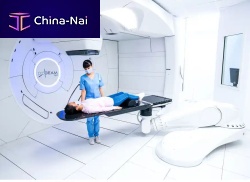 Proton therapy cyclotron with robotized positioning table ProBeam 360�with integrated CT scanner
